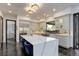 Bright kitchen featuring a large island, stainless steel appliances, and a breakfast bar at 6111 Huron Pl, Castle Rock, CO 80108