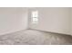 Clean bedroom with soft carpet, and a window view of the neighborhood at 11039 Snowdon St, Parker, CO 80134