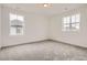 Neutral bedroom featuring large windows and soft carpeting providing a peaceful atmosphere at 11039 Snowdon St, Parker, CO 80134
