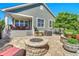 Outdoor patio, fire pit and lush foliage create a relaxing backyard retreat at 16043 Azalea Ave, Parker, CO 80134
