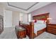Comfortable bedroom featuring a wooden bed frame, storage, and soft carpet at 16043 Azalea Ave, Parker, CO 80134