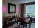 Cozy dining room with wood table set, accent lighting, and nearby window at 16043 Azalea Ave, Parker, CO 80134
