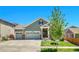 Charming two-story home with a three-car garage and well-manicured lawn, perfect for Gathering living at 16043 Azalea Ave, Parker, CO 80134