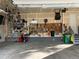 Attached garage with work bench, storage and work lighting at 16043 Azalea Ave, Parker, CO 80134