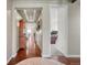 Elegant hallway features hardwood floors, recessed lighting and a decorative ceiling that creates a welcoming entrance at 16043 Azalea Ave, Parker, CO 80134