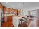 Modern kitchen with stainless steel appliances, a large island, and an adjacent dining area is perfect for entertaining at 16043 Azalea Ave, Parker, CO 80134
