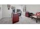 Functional home office with desk, chair, shelving, and a well-lit window at 16043 Azalea Ave, Parker, CO 80134