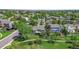 Aerial view of a neighborhood with mature trees, showcasing the property's backyard and landscaping at 20591 E Weaver Ave, Aurora, CO 80016