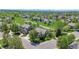 Scenic aerial view of a home in a neighborhood adjacent to a park with mature trees at 20591 E Weaver Ave, Aurora, CO 80016