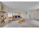 Spacious finished basement with a fireplace, neutral carpet, and cozy seating area at 20591 E Weaver Ave, Aurora, CO 80016