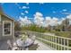 Enjoy outdoor dining on this deck overlooking serene neighborhood views and a clear blue sky at 20591 E Weaver Ave, Aurora, CO 80016