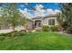 Charming home with a well-manicured lawn, lush landscaping, and beautiful curb appeal at 20591 E Weaver Ave, Aurora, CO 80016