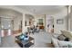 Open living space with dining area, neutral color palette, and archways for easy transition at 20591 E Weaver Ave, Aurora, CO 80016