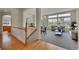 Open-concept living room featuring hardwood floors, large windows, and seamless flow to dining area at 20591 E Weaver Ave, Aurora, CO 80016
