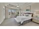 Serene main bedroom with tray ceilings, a bay window sitting area, and neutral tones at 20591 E Weaver Ave, Aurora, CO 80016