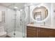 Modern bathroom with glass shower enclosure, large vanity, and illuminated mirror at 3100 E Cherry Creek South Dr # 1403, Denver, CO 80209