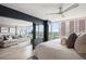 Bedroom with an open wall to the living area and expansive views from the large windows at 3100 E Cherry Creek South Dr # 1403, Denver, CO 80209