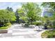 Community courtyard and grill area with seating and lush landscaping at 3100 E Cherry Creek South Dr # 1403, Denver, CO 80209