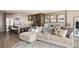 Bright living room with a sectional couch and an open view of the kitchen at 3100 E Cherry Creek South Dr # 1403, Denver, CO 80209