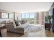Bright living room with large windows and hardwood floors at 3100 E Cherry Creek South Dr # 1403, Denver, CO 80209