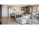 Open living room and kitchen space with hardwood floors and comfortable seating at 3100 E Cherry Creek South Dr # 1403, Denver, CO 80209
