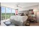 Comfortable main bedroom with large windows and a tufted headboard at 3100 E Cherry Creek South Dr # 1403, Denver, CO 80209