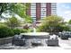 Relaxing outdoor patio with a tranquil fountain and cozy seating area at 3100 E Cherry Creek South Dr # 1403, Denver, CO 80209