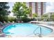 Community outdoor pool with lounge chairs and seating, next to the high-rise at 3100 E Cherry Creek South Dr # 1403, Denver, CO 80209