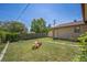 Spacious backyard with lush green grass, wooden fence, and outdoor play equipment, perfect for outdoor fun and activities at 7820 Tejon St, Denver, CO 80221