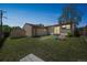 Lush backyard with shed, patio area, play equipment, and a wooden fence, creating a peaceful outdoor retreat at 7820 Tejon St, Denver, CO 80221