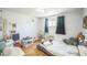 bedroom with hardwood floors, storage, and play areas at 7820 Tejon St, Denver, CO 80221