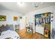 bedroom featuring hardwood floors and ample space for a bed and play area at 7820 Tejon St, Denver, CO 80221