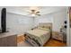 Cozy bedroom with a ceiling fan and natural light from two windows at 7820 Tejon St, Denver, CO 80221
