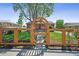 Lovely home featuring a charming fenced yard with an inviting arched entryway at 7820 Tejon St, Denver, CO 80221