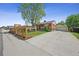 Charming brick home featuring a spacious driveway and well-maintained landscaping at 7820 Tejon St, Denver, CO 80221