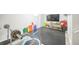 Home gym with mounted TV, gymnastic equipment, weights, and rubber flooring, ideal for training and entertainment at 7820 Tejon St, Denver, CO 80221
