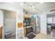Kitchen with stainless steel appliances and light wood cabinetry with a view to the living room at 7820 Tejon St, Denver, CO 80221