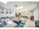 Bright, open living space with skylights and seamless flow to kitchen and dining areas at 7820 Tejon St, Denver, CO 80221