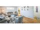 Comfortable living room with hardwood floors, neutral decor, and view to kitchen at 7820 Tejon St, Denver, CO 80221