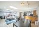 Open-concept living area with skylights, dining area, and a view into the kitchen at 7820 Tejon St, Denver, CO 80221