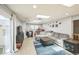 Spacious living room with large sectional sofa, skylights, and modern decor at 7820 Tejon St, Denver, CO 80221