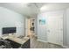 Bright office area with desk, computer, and view to an adjacent flex space at 7820 Tejon St, Denver, CO 80221