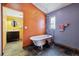 Claw foot tub and dark slate flooring in updated bathroom at 308 Inca St, Denver, CO 80223