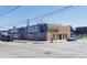 Commercial brick building with artistic murals on the exterior at 308 Inca St, Denver, CO 80223