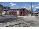 Commercial building featuring modern architecture, large windows, and ample parking space at 308 Inca St, Denver, CO 80223