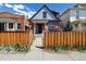 Inviting home with a charming front yard and pathway leading to the entrance at 308 Inca St, Denver, CO 80223
