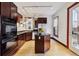 Modern kitchen featuring dark cabinets, stainless steel appliances, and an island at 308 Inca St, Denver, CO 80223