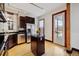 Well-appointed kitchen with stainless steel appliances and a functional island at 308 Inca St, Denver, CO 80223