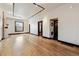 Spacious living room with hardwood floors, modern lighting, and an open floor plan at 308 Inca St, Denver, CO 80223