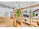 Bedroom area featuring a wooden bookshelf divider, hardwood floors, and a minimalist design at 2000 Arapahoe St # 503, Denver, CO 80205